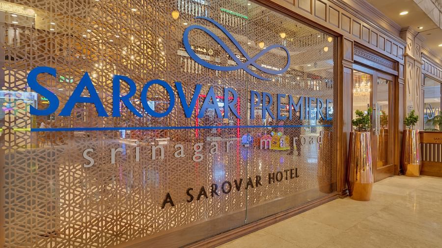 An image of the entrance to our hotel with a signboard indicating the hotel name - Sarovar Premiere, Srinagar